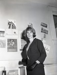 Woman with wall advertisements by John Foster